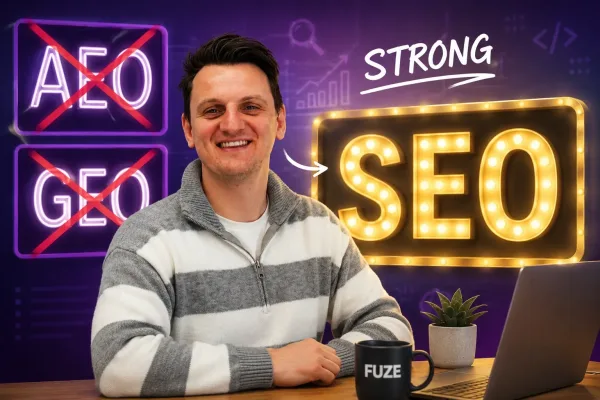 rhys sitting at a desk with fuze mug and laptop in front of him with AEO and GEO crossed out on the left and in strong lights SEO on the right